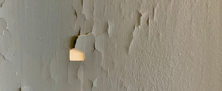 image of peeling paint on a wall